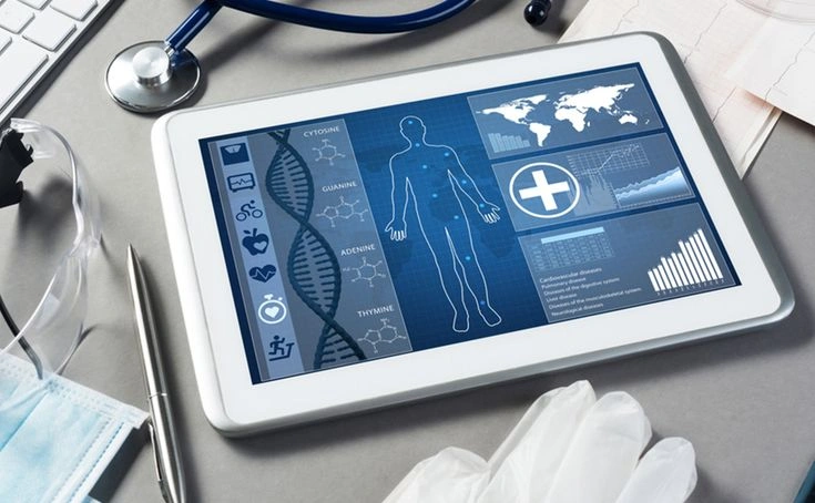 Clinician reviewing patient data on a tablet device